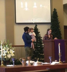 Family with child doing Advent reading